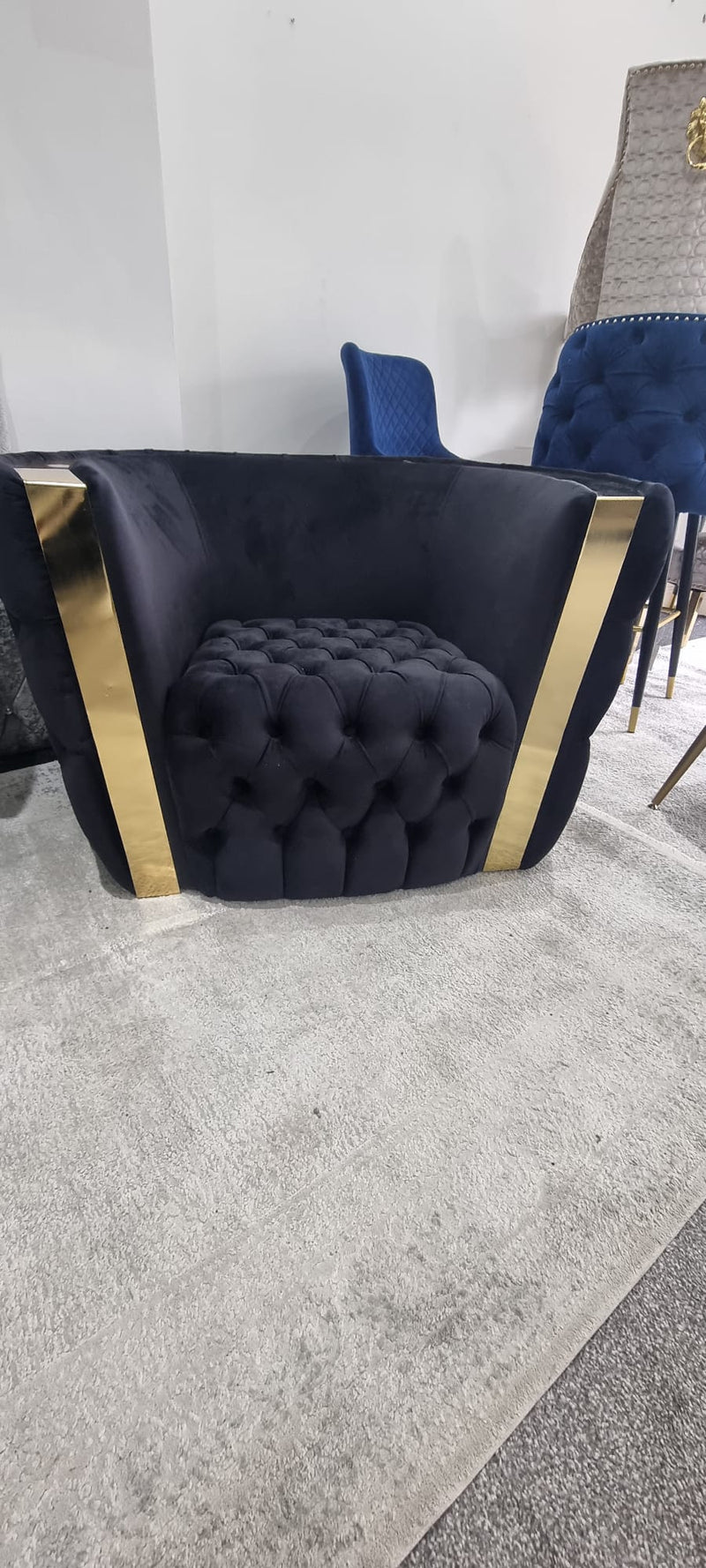 Rolex Arm Chair in Black and Gold Detailing