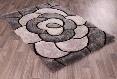 The 3D Carved Rose Charcoal rug features a unique 3D-carved rose pattern, bringing a modern and chic touch to any room. Crafted out of charcoal, this rug is sure to be durable and stands up to everyday wear and tear.